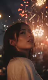 a woman standing under a fireworks display