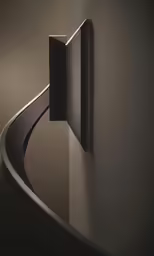 an object on the wall near some black wires