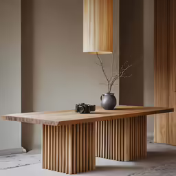 a large wooden table with a vase on it