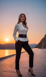 a woman in high heels standing in front of a body of water