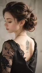 this lady with her tattoo is wearing a dress