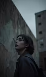 an asian woman is looking at something behind her