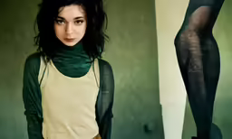 the woman wearing an over - sized top and tights is standing with her leg in front
