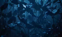 water droplets are pouring on the branches of trees in an otherwise foggy, dark and gloomy landscape