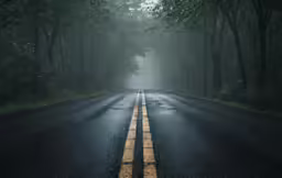 a wet highway with no car in it