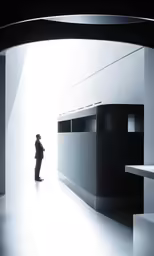 the person is standing outside of the large hallway