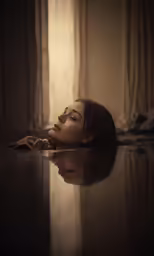 a woman laying on the floor with her eyes closed