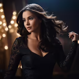 a woman wearing black posing for a portrait