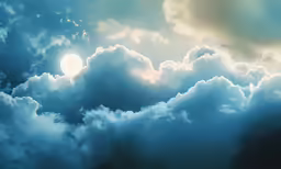 some big fluffy clouds in the sky with a bright circle