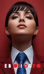 a woman in a red jacket and tie posing for a picture