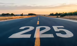 the empty road is marked with a white twenty - one - two - five number