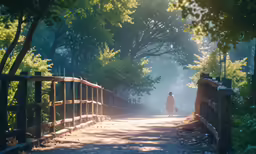 a woman in a pink jacket walking on a path through a forest