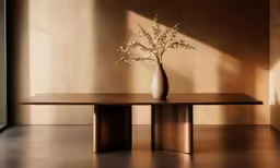 a vase with flowers sits on a table