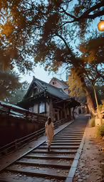 a person walking down some stairs under a tree