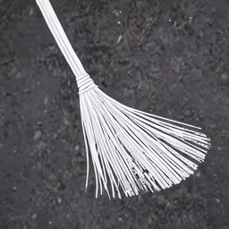 the image shows an upside down white broom