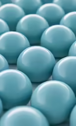 a closeup of several blue candy candies
