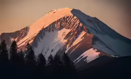 a snow - capped mountain peaks in the sunset light