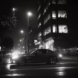 a car at night driving down the road