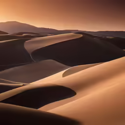 the sun is rising on the dunes in desert
