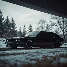 the car is parked in the snow near a bridge