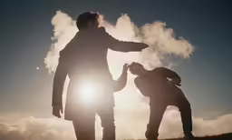 the man and woman are standing outside near each other