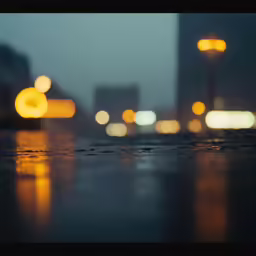 blurred blurry city lights and raindrops on a table