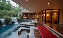 the inside of a large modern home with pool