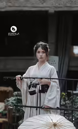 an asian woman wearing a white dress holding a white umbrella