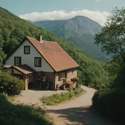 a house with large mountains in the background