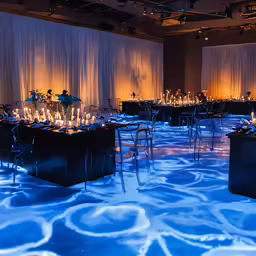 a very modern and elegant room with a long table