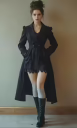 woman with very short legs wearing black coat