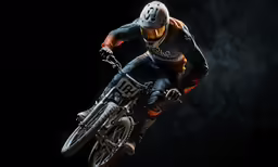 a man riding a bike up the side of a hill
