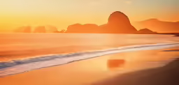 a large rock in the ocean near an ocean front