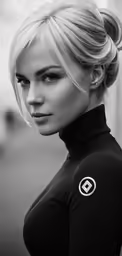 a woman with pigtails and a black turtle neck shirt