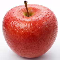 an apple is covered with water droplets on it