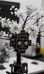 a black and white picture with white flowers and skull decoration