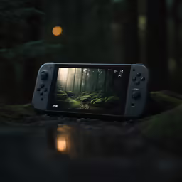 a black game boy with trees on it