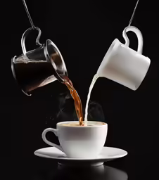 tea is pouring into a cup in the middle of a saucer
