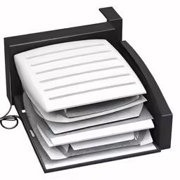 several white papers are stacked in a drawer