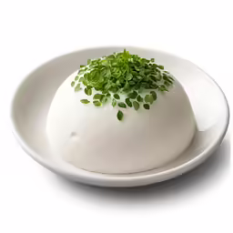 the food in this white bowl contains fresh herbs