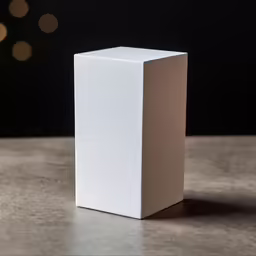 a white cube box sitting on top of a table
