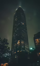 the building at night has many lights on