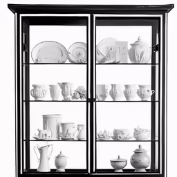 a black and white photo of a glass fronted cabinet filled with china