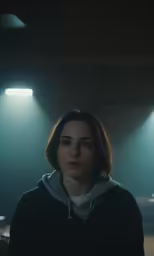a person is standing in a dark room
