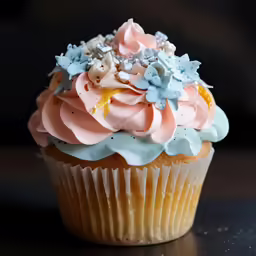 a close up of a cupcake with frosting and decorations