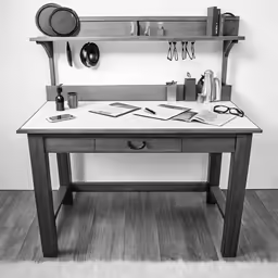 a wooden table topped with lots of office supplies