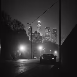 a car is parked on the side of a street in the city