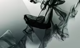 a black and white image of abstract art