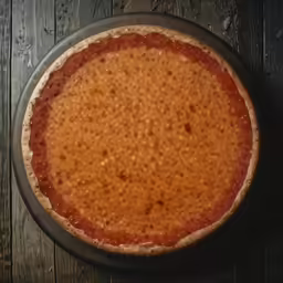 a pizza crust sitting on top of a pan
