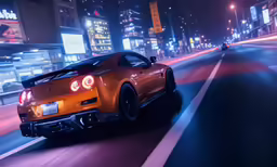 a orange car on the road at night